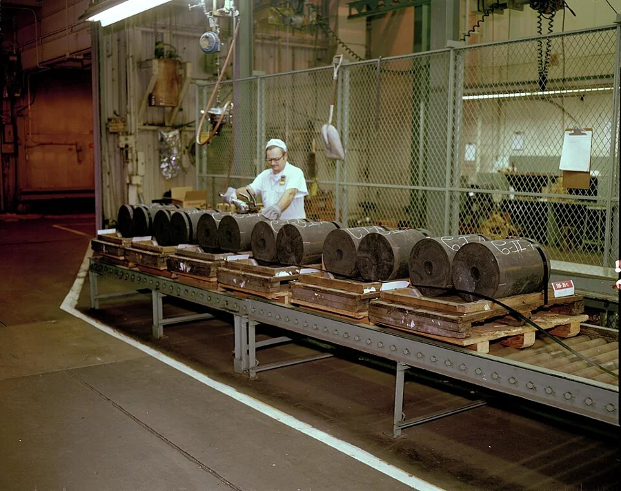 A steel fabrication line with components on a rack